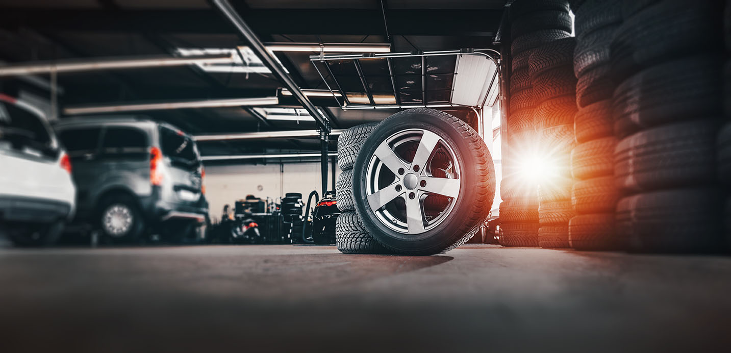 Tire,At,Repairing,Service,Garage,Background.,Technician,Man,Replacing,Winter